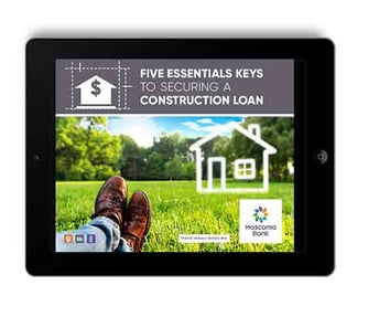 Ipad displaying man laying on grass with text that reads, "Five essential keys to securing a construction loan"